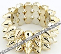 Pulseira larga dourada espetos